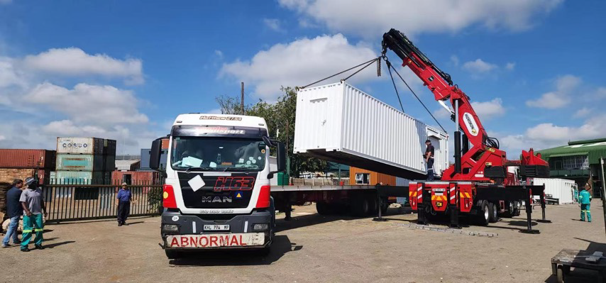 Container BESS being positioned at a project site